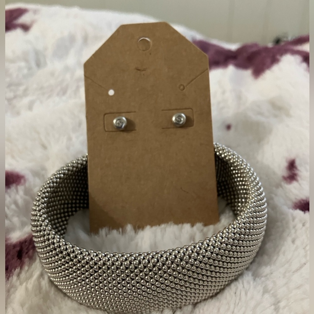Cuff bracelet and diamond earrings